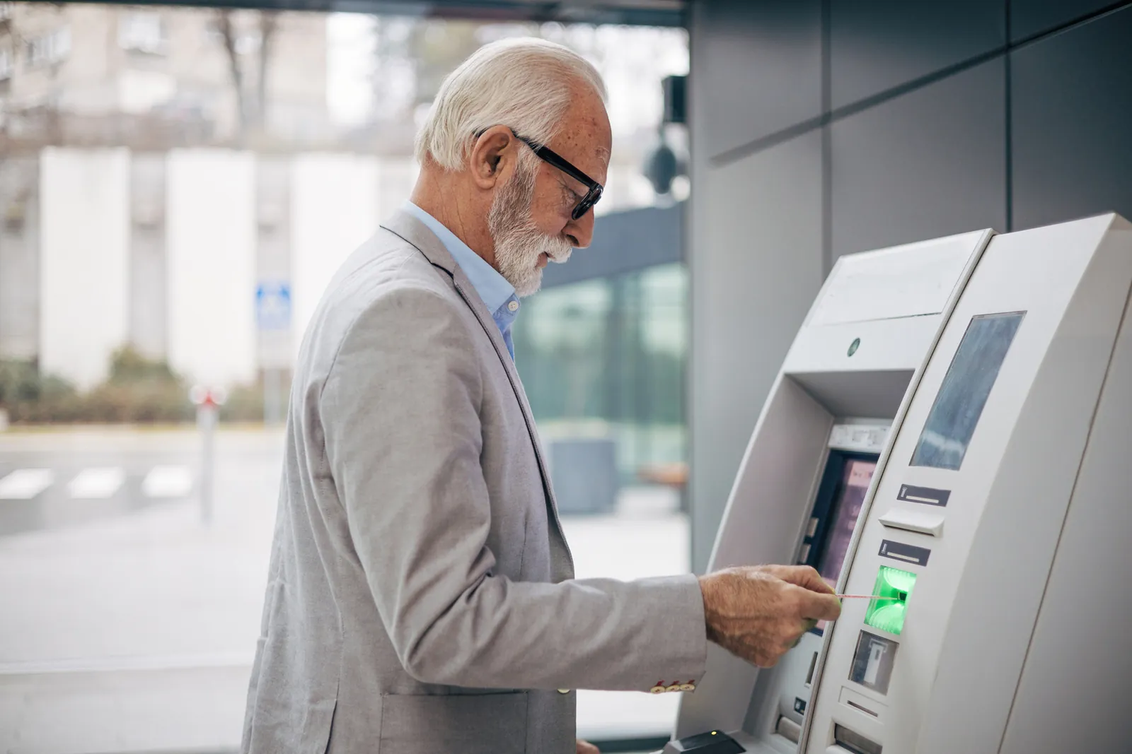 Customer using an ATM at a bank branch