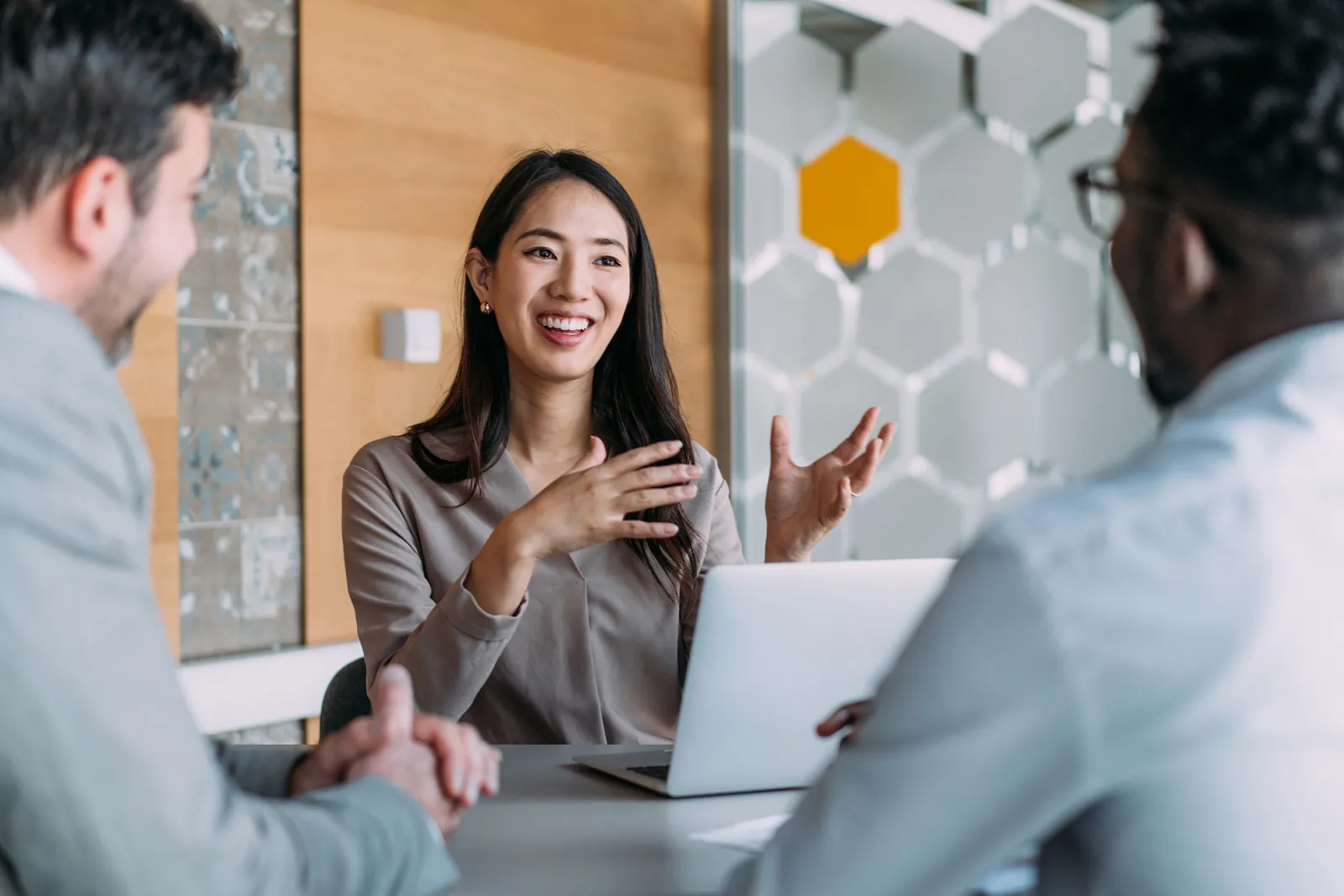 Financial services adviser in a meeting with clients